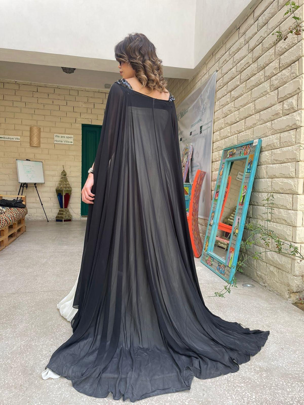 Reehan - Trapeze caped dress